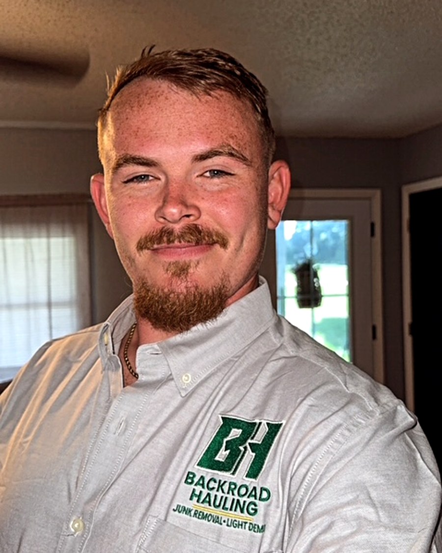 David, owner and operator of Backroad Hauling, in company shirt